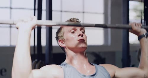 Fitness man doing weight lifting exercise at the gym