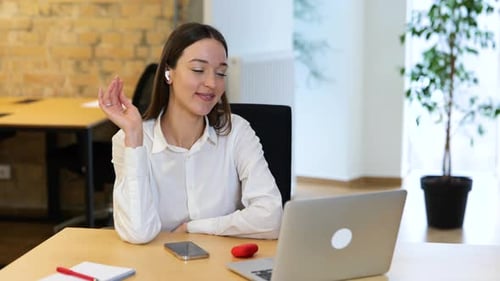 Woman Enjoying Music in Modern Office Environment
