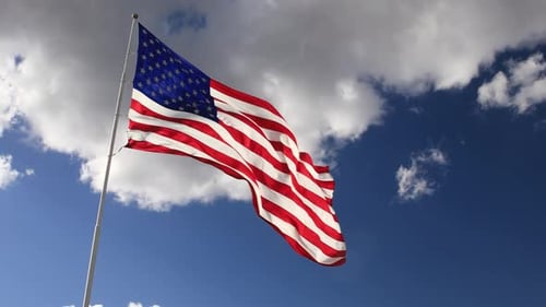 American Flag Waving Proudly in the Blue Sky