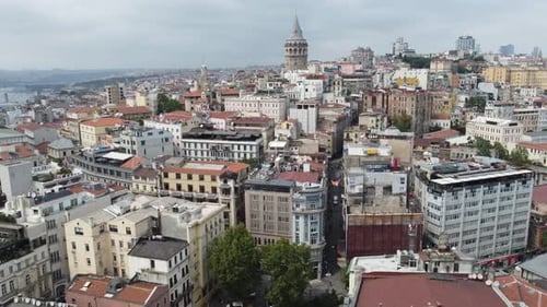 Aerial video of galata tower in beyoglu istanbul with city, building and sea around it