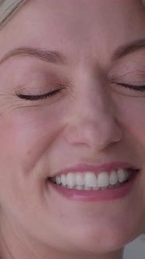 Woman's Radiant Smile in Close Up Portrait