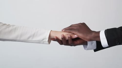 Person Giving Comfort and Support with Hand Holding