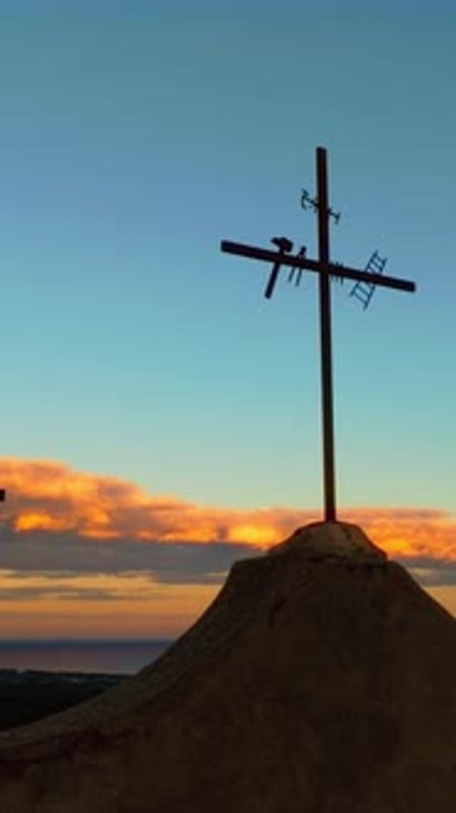 Christian Religious Crosses on Mountain As a Symbol of God in the Sunset Sky