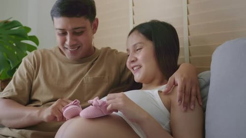 Loving Couple Excitedly Awaits New Baby at Home