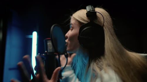 Popular Talented Woman Singer Recording New Track in Musical Studio Rear View Professional Singer or