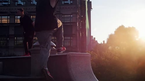 Two Acrobatic Men Jump Off the Stand Sunset