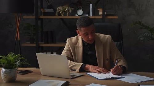 Man Working at Desk in an Office
