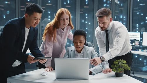 Close Up Team of Multiethnic IT Specialists Communicating in Server Room African American Woman