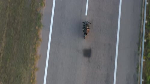Top View to Biker Driving Motorbike During Road Trip Man Ride Fast on Modern Sport Motorcycle at