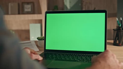 Online Student Watching Mockup Laptop at Home Close Up Man Looking Green Screen