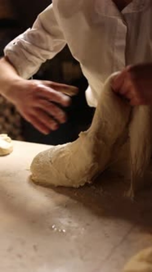 A baker prepares delicious bread.Close-ups