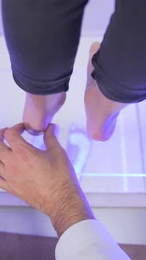 Medical Exam of Woman's Foot with Technology