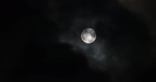 Full Moon Obscured by Dark, Ominous Clouds