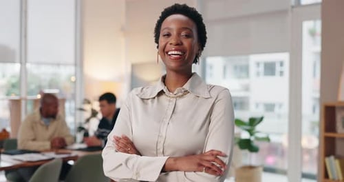 Confident Woman Smiles in Modern Workplace Environment