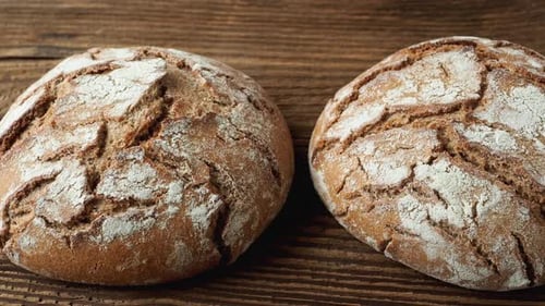 Rustic Loaves of Bread on a Wooden Surface