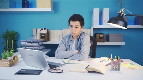Young man looking around sluggish, unhappy and thoughtful.