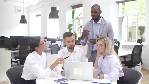 Multiethnic Business People During Meeting in Modern Office