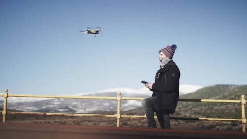 Filmmaker pilot flying a dji mavic drone at Madrid Spain