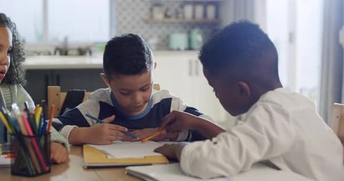 4k video footage of a group of young friends doing their homework together at the kitchen table