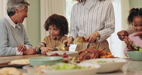 Happy Family Cooking and Serving Meal Together