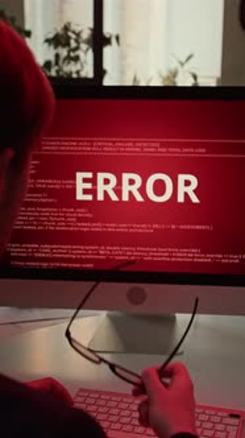 Vertical of Young Office Worker Facing System Error during Workday at Computer