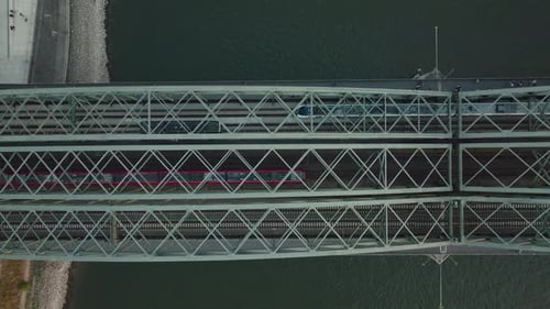 Drone moves backwards, while two trains are driving in opposite directions on the Hohenzoller Bridge