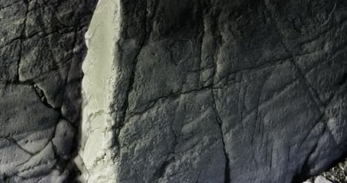 Natural Rock Formation Showcasing Intricate Textures and Shadows in Soft Light