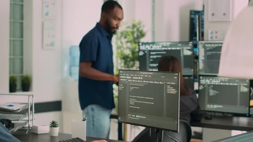 Asian Programer Developing Database Interface and Writing Server Code