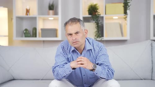 Man looking negative at camera.