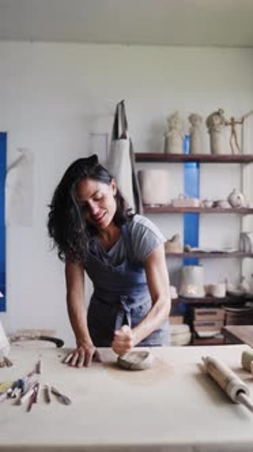Art business, Artist work with ceramic at clay pottery workshop studio. Woman doing sculpture