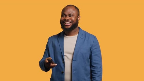 Man Zapping Through Various TV Channels Looking for Entertaining Content