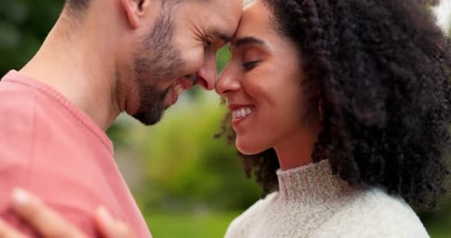 Smiling Couple Touching Foreheads in Loving Intimacy