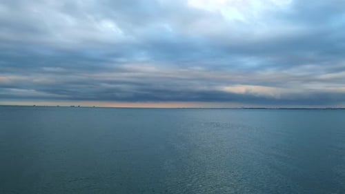 Sunset on the Background of Sea Waves