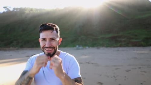 Man Practicing Boxing on the Beach