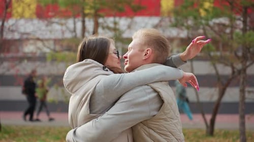 Loving Couple Embracing in Autumn Park