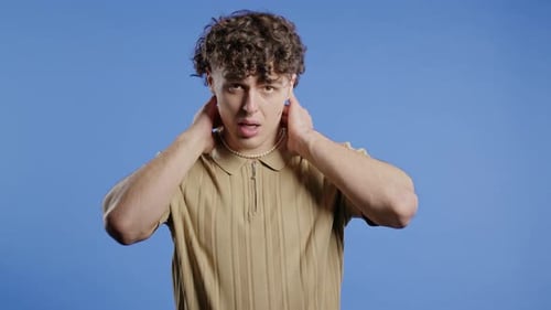 Young Man Experiencing Neck Pain and Discomfort