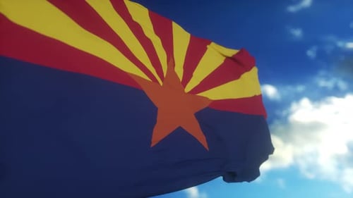 Waving Arizona State Flag Against a Clear Blue Sky