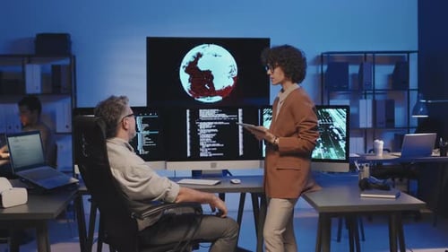 Colleagues Discussing Computer Codes in Team