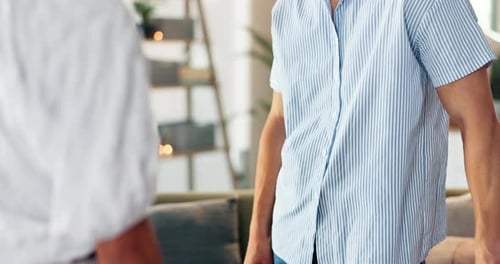 Man Gives Red Roses to Woman in Home