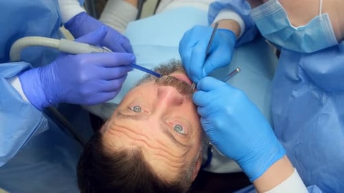 Mature Bearded Man is Afraid of Male Dentist and Screams While Sitting in the Dentist's Chair Horror