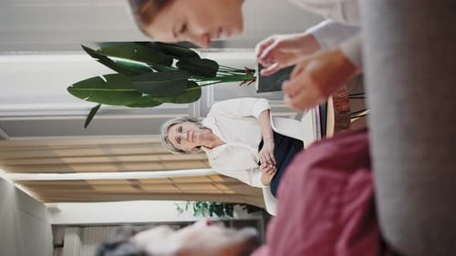 Woman with Gray Hair Talking to Friend