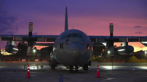 Military Transport Airplane Parked at Dusk