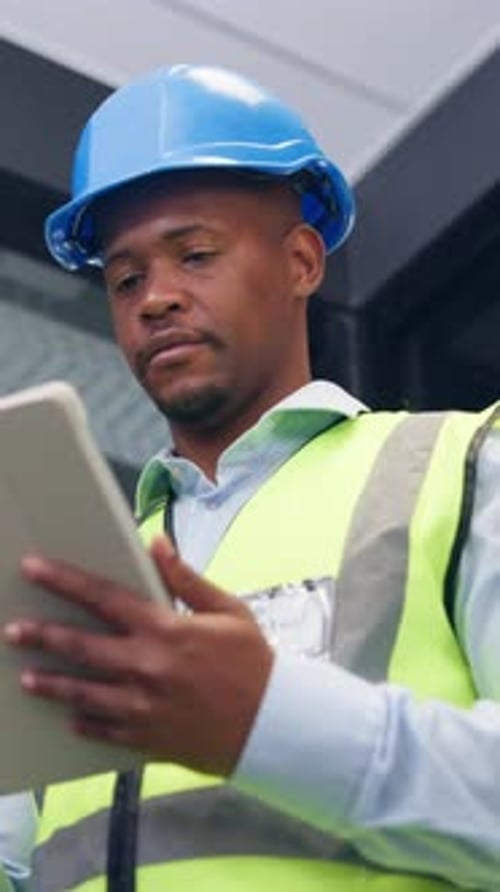 Black man, tablet and engineer in building for construction development, schedule and planning