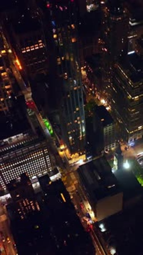 Night time at never sleeping New York. Drone footage over the high-rise buildings