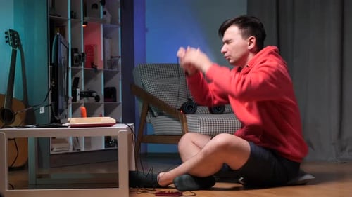 Man Playing Old Video Game at Home