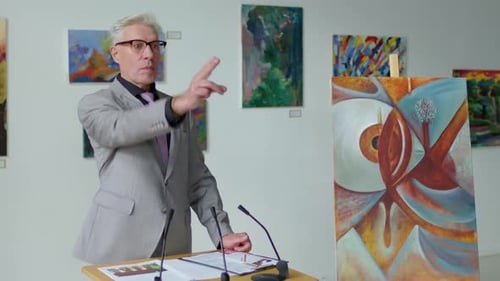 Man Discussing Abstract Painting in Art Gallery