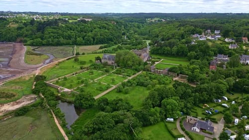 Approaching drone movement to the gothic Abbaye de Beauport historical abbey on beautiful parklands
