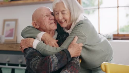 Senior Couple Share Loving Embrace at Home