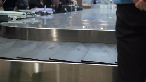Bags Travel on a Luggage Carousel at an Airport