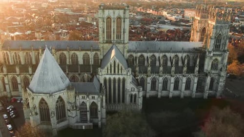 Drone truck movement across iconic huge gothic cathedral on bright morning sunrise
